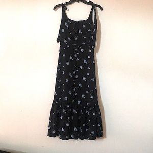 Long black dress with light blue flowers.